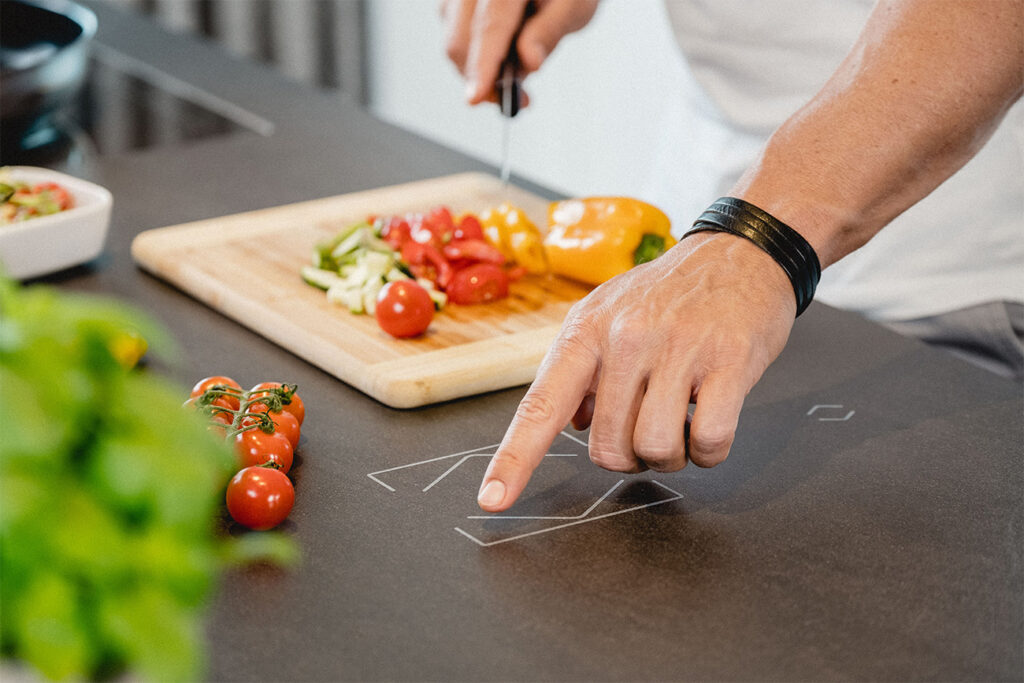 (c)Loxone_kitchen-man-cooking-touch-surface_02